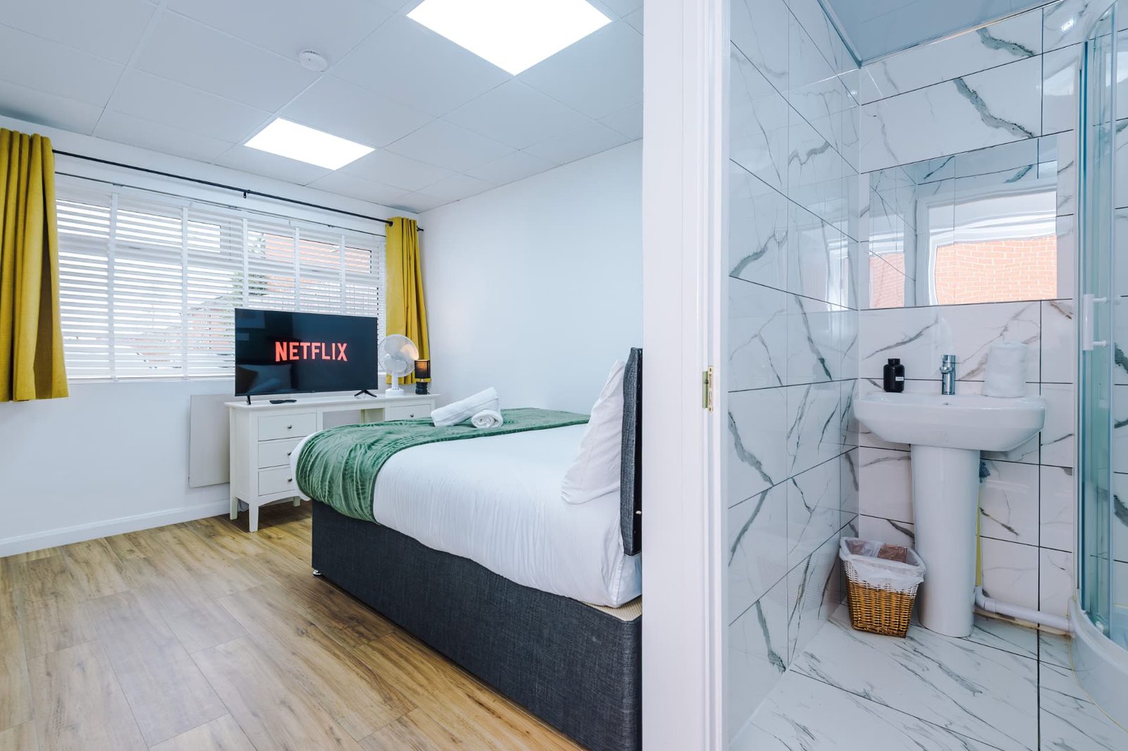Furnished bedroom with en-suite facilities in South Manchester workforce accommodation